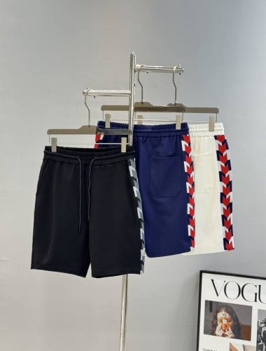 上衣- 。裤子- 。 Moncle*R蒙口25S潮牌五分短裤.超高品”2025新款运动套装.男女同款！休闲运动风格.经典大牌新推系列将条纹Mm织带巧妙融入运动装