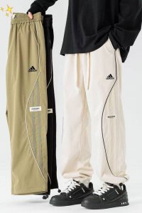 上新 阿迪达斯Adidas2025春夏秋季新款男女同款 抽绳薄款伞兵裤，将军工风的硬朗与都市时尚完美集合 采用高品质面料，兼顾舒适与挺括感。无论是日常通勤还是周