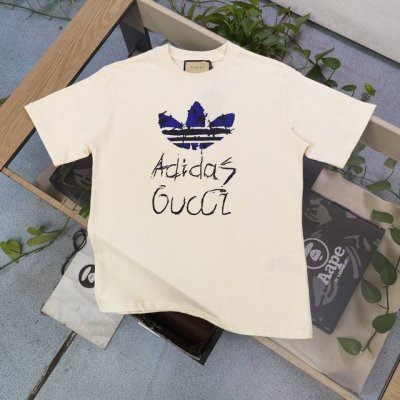 款号 Xd8808 高版本 2025新款Gucciadidas古驰联名阿迪达斯三叶草卡通字母图案Logo印花休闲情侣短袖T恤 独一无二的活性环保面料染色 32支