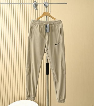 清薄透气 后腿处激光冲孔透气清凉 钩子耐克Nike Nk男款夏季弯刀版型轻薄拼接休闲裤 尺码:M,L,Xl,2Xl,3Xl 黑色,卡其,军绿 四面弹户外速干面料