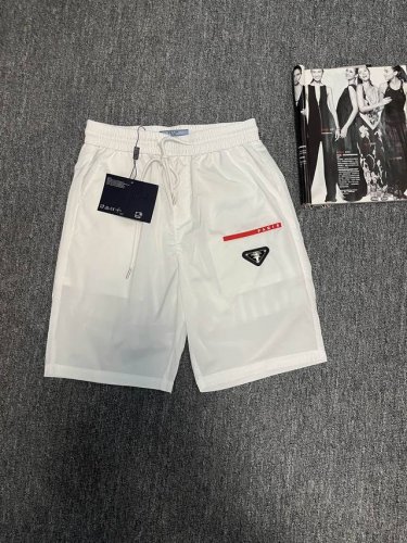 普拉达 Prada三角标短裤 夏季新品短裤 专柜同步有售，三标齐全 带洗水唛 原单货 情侣款、时尚休闲裤 速干裤 沙滩裤，进口原版速干面料，上身舒适透气，档次极