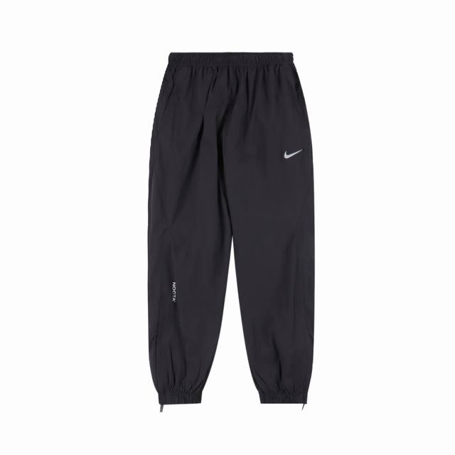 310 Nike X Drake 联名款 Nocta系列 拉链口袋中腰宽松束脚运动裤 同款外套在售 情侣款 面料采用梭织原版定制 功能性防水面料 Logo印花全