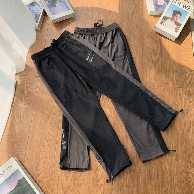 140 nike耐克经典双钩全刺绣标专柜款运动束脚裤 定制专柜70D尼龙四面弹一分格透气防水珠面料 90%锦纶 10%氨纶三标一至专柜裤脚弹力绳 全刺绣标 季节