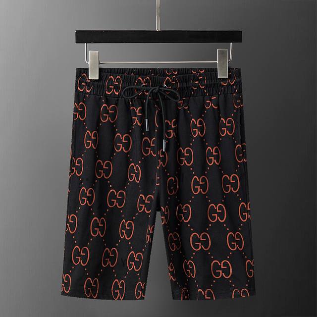 Gucci 古驰 2025年春夏新款男装休闲短裤，双色面料，激光烧花显底色，款式时尚 帅气，面料舒适，做工严谨 ，走线工整。上身效果好 码数 M-3Xl 黑橙色