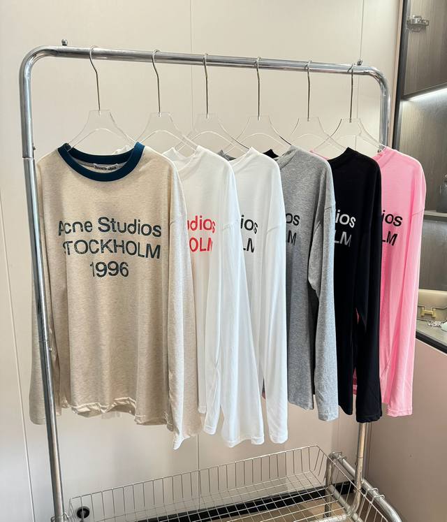 品名：Acn* Studios新款做旧字母丝薄长袖T恤 尺码：M.L 颜色：白色黑字 白色红字 燕麦 灰色 黑色 粉色 手感是非常丝滑冰凉的，面料韧性很大，巨透