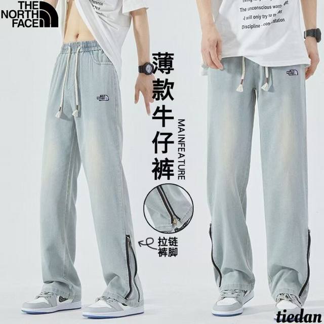 北面The North Face春夏季新款 男女同款松紧腰抽绳裤脚侧边拉链水洗牛仔裤 男士简约风皮标Logo牛仔冰丝裤 休闲裤直筒裤 冰丝牛仔设计透气舒适百搭