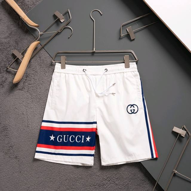 gucci 古驰 2025春夏季新款休闲高品质 速干裤梭织面料 沙滩裤 超高端品质3D数码印花工艺制作而成 原版复刻 整体提花最新字母联盟Logo图案设计 纤维
