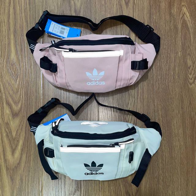 Adidas阿迪达斯三叶草3M反光条多功能运动休闲腰包手提包单肩包斜挎包 颜色：白色 粉色 尺寸：26X16X10 Cm 1809