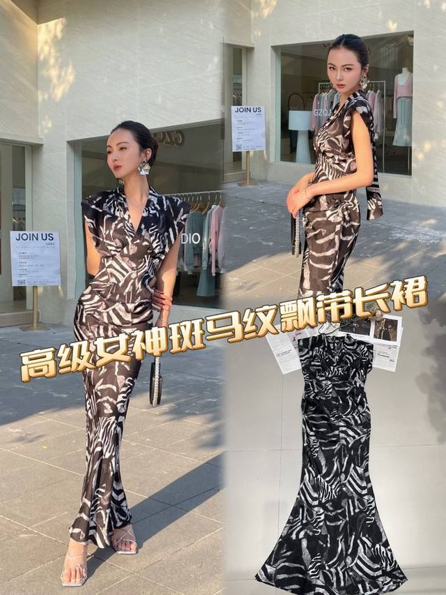 独家原创设计 斑马纹飘带长裙，设计独具匠心。V领与无袖组合，简约大方，勾勒出优美脖颈与手臂线条。经典斑马纹元素，复古又不失时尚感。背部飘带灵动飘逸，为整体造型添