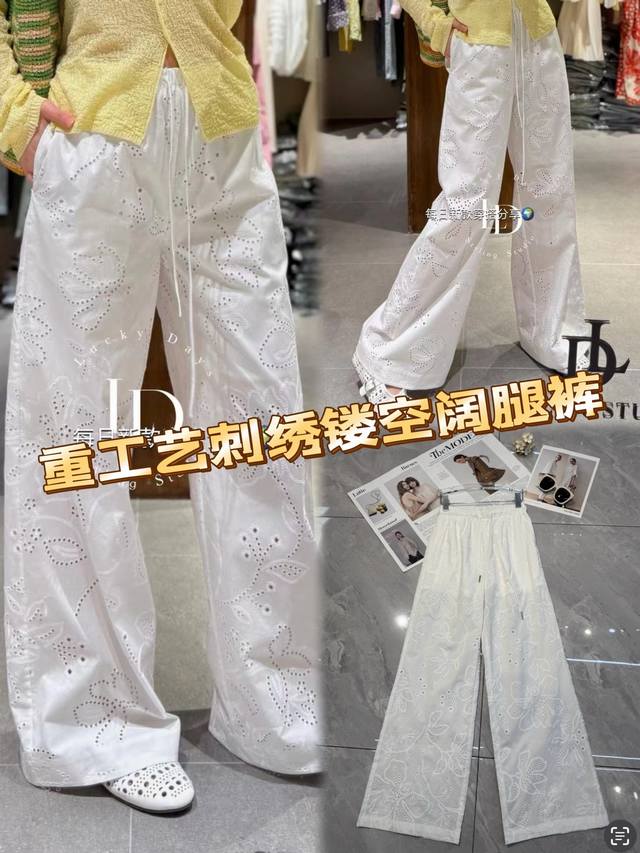 白色重工艺刺绣镂空阔腿裤，宛如艺术杰作。精致刺绣勾勒曼妙花纹，镂空设计增添灵动与性感，似有若无间尽显独特韵味。宽松阔腿版型，包容身形，走路带风。抽绳设计增添随性