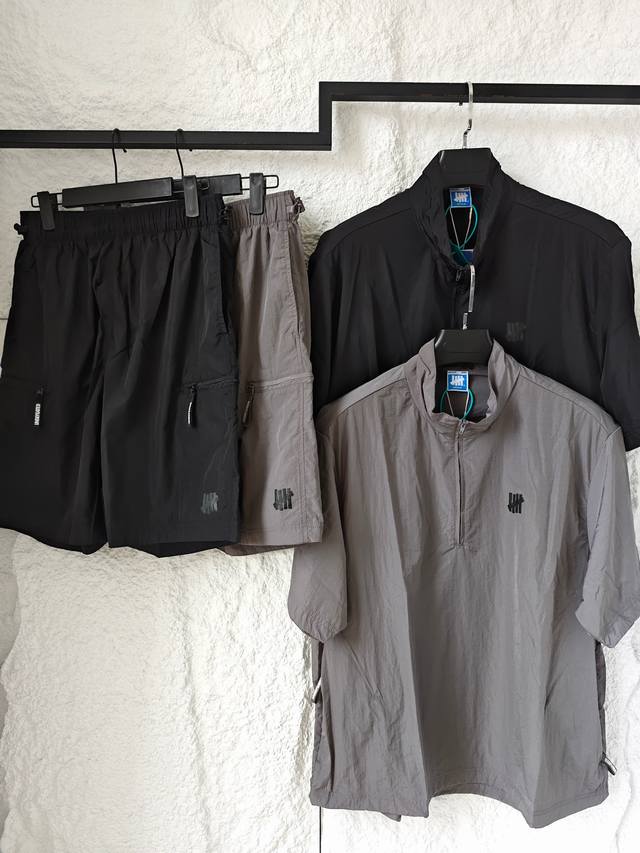 衣服 短裤 Undefeated Ss 五条杠经典五道杠复古运动纯色半拉链短袖衬衫 拉链口袋休闲短裤 套装 男女同款 融合机能美学与高级质感 哑光金属微粒质感，
