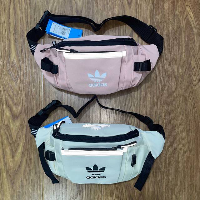 Adidas阿迪达斯三叶草3M反光条多功能运动休闲腰包手提包单肩包斜挎包 颜色：白色 粉色 尺寸：26X16X10 Cm 1809