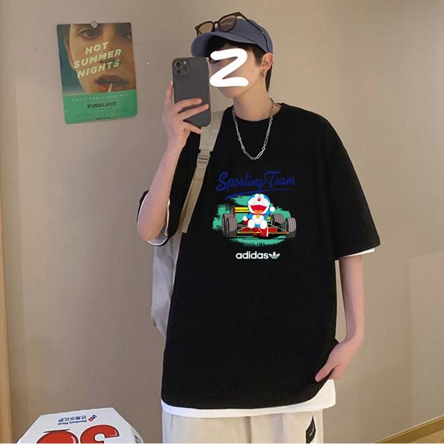 Adidas 阿迪达斯三叶草 夏季海外版机器猫卡通印花纯棉圆领短袖T恤上衣 甄选260G精梳棉纯棉面料，定制螺纹领口，胸前哆啦A梦机器猫卡通印花设计，趣味性十足