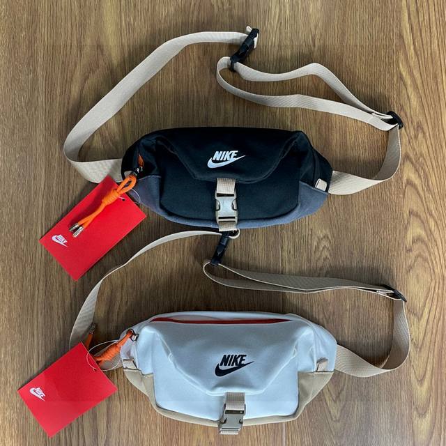 Nike耐克折叠卡扣拼色包包多功能运动休闲腰包胸包手提包单肩包斜挎包质感舒适面料，防刮耐磨材质：尼龙颜色：黑色 白色尺寸：29X12X07 Cm Id：803