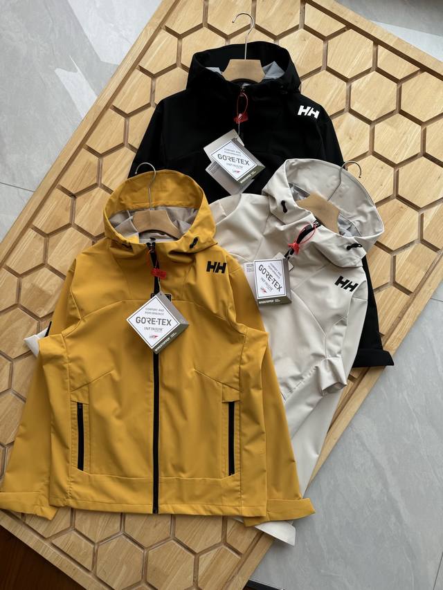 Helly Hansen 压胶高版本海丽汉森情侣拼接一体防泼水外套，Salt高端系列户外防风防水无缝压胶硬壳冲锋衣，专为户外运动人体工学设计，肩膀Logo设计别